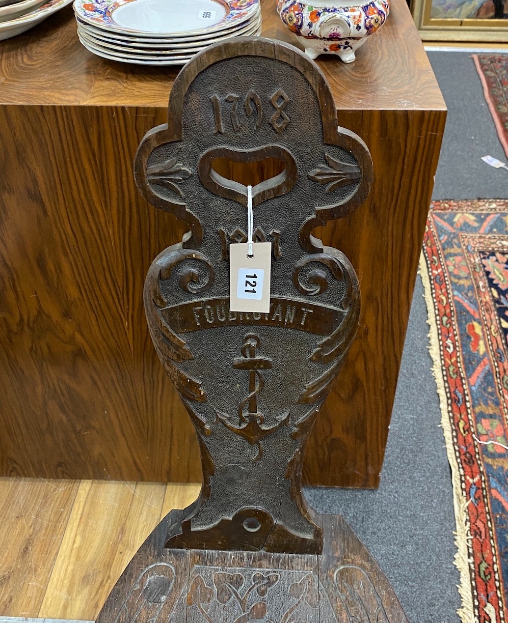 A Victorian carved oak spinning chair, by repute made from the timbers of HMS Foudroyant, dated 1897, height 88cm